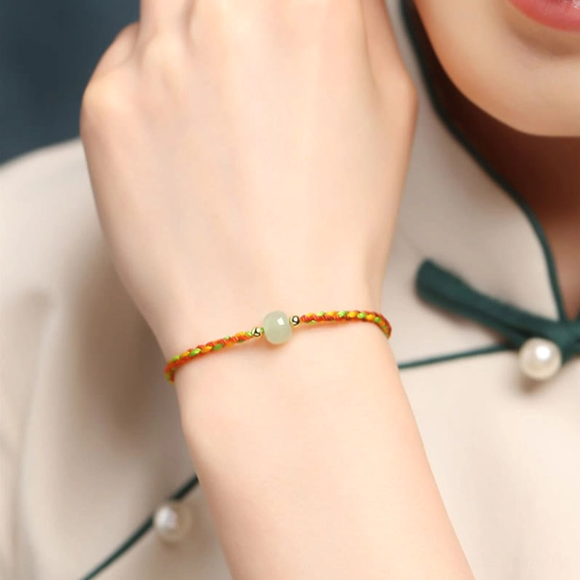 Colorful jade prosperity bracelet worn on wrist with traditional Chinese outfit styling