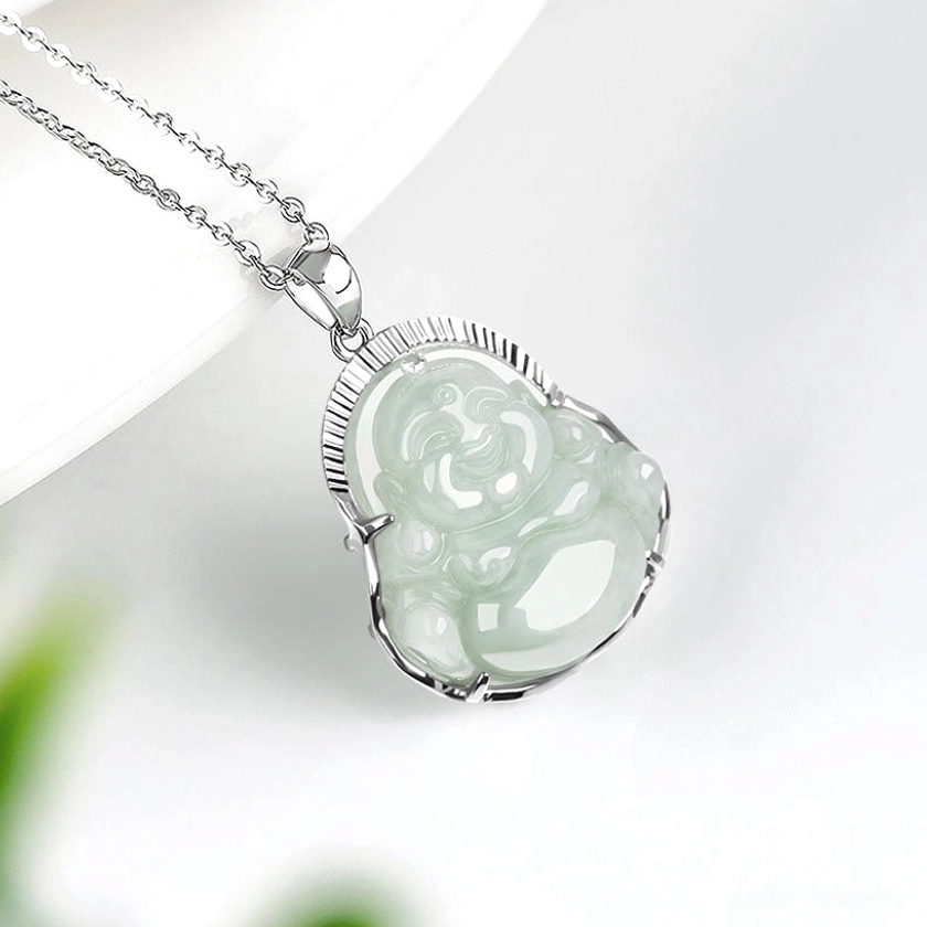 Jade Buddha pendant close-up from angled perspective displaying smooth hand-polished natural jade texture and metal bezel setting