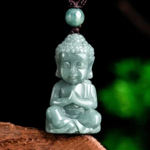 Natural jade Buddha meditation pendant necklace with brown cord, frontal view on wooden display
