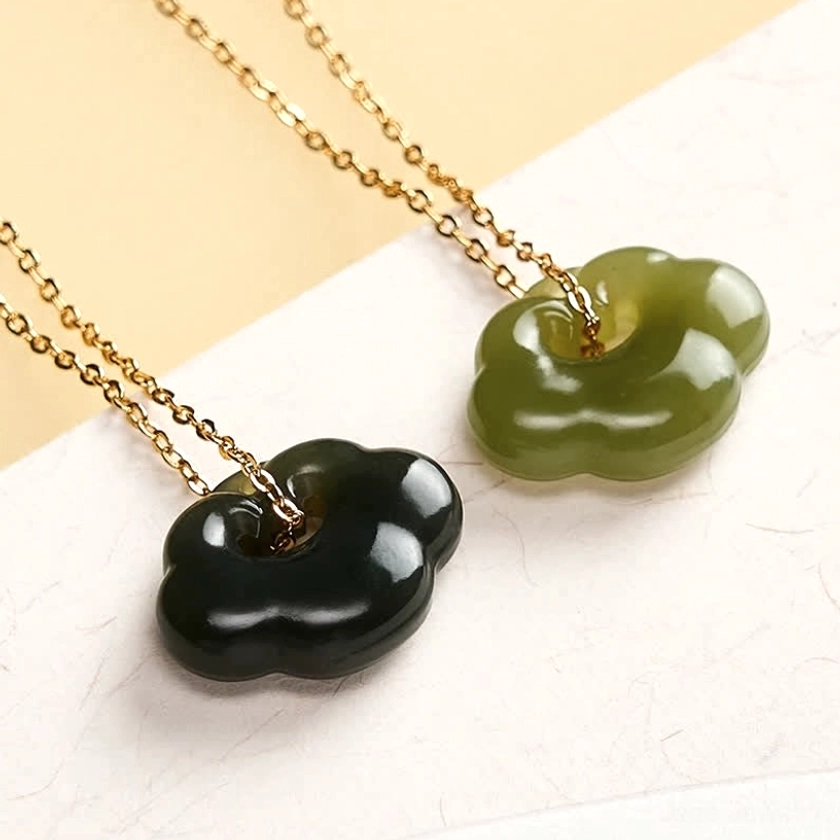 Two Hetian jade cloud lock pendant necklaces comparison showing light celadon and deep forest green color variants with metallic chains