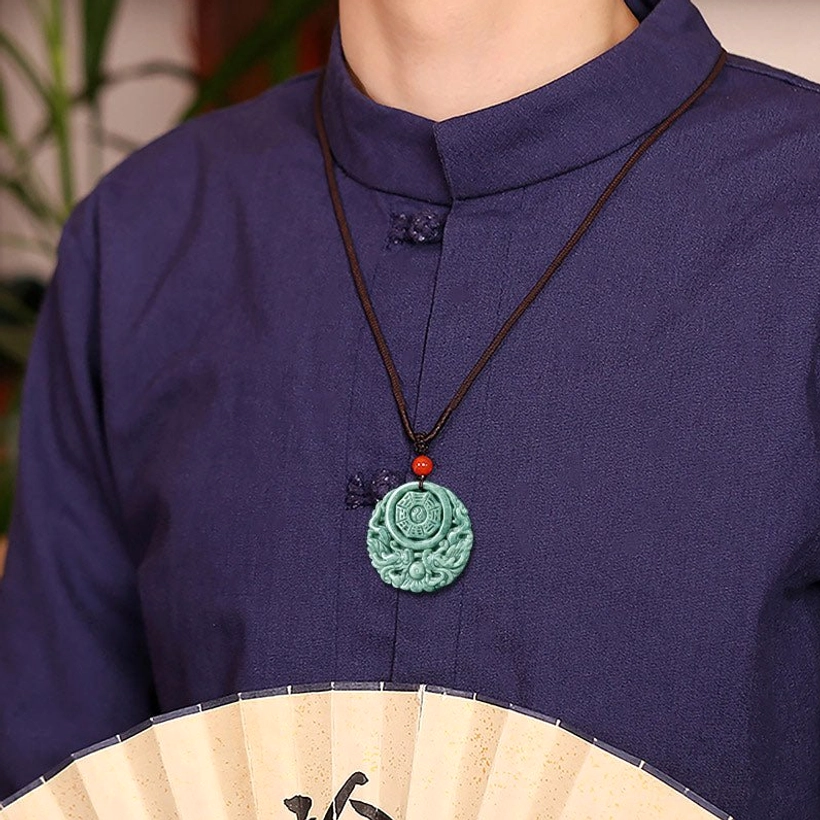 Jade yin yang dragon necklace worn on model showing everyday styling and wearable length