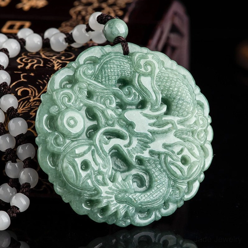 Handcrafted jade dragon pendant necklace with brown woven cord and white agate beads - detailed carving visible