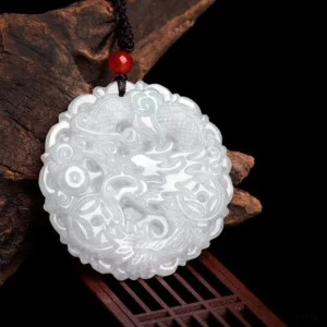 Close-up of handcrafted white jade dragon necklace showing intricate carving detail, polished jade surface on wooden display