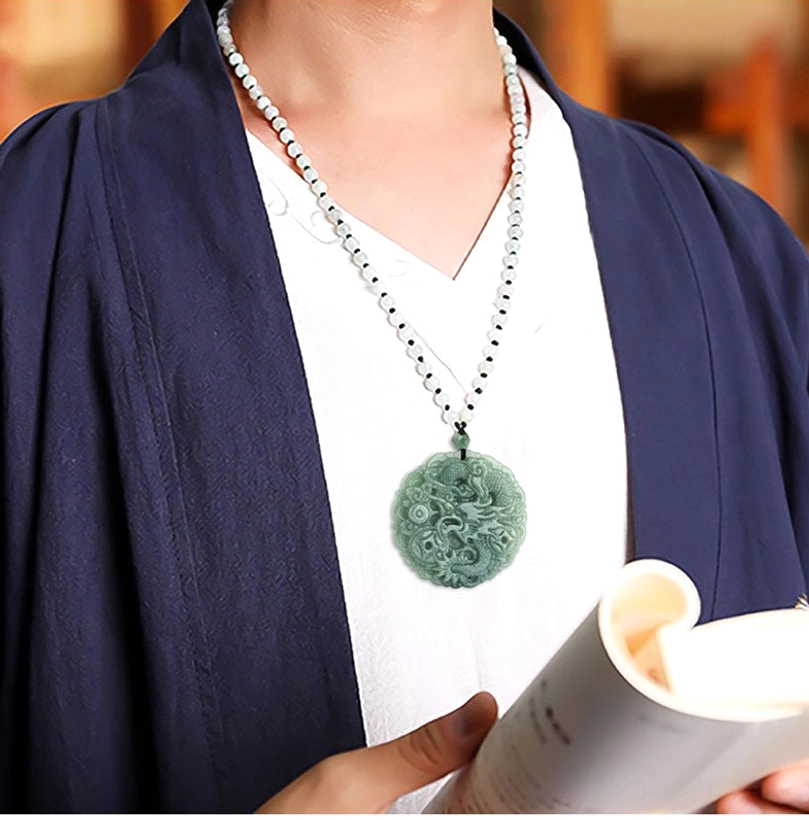 Woman wearing jade dragon pendant necklace with blue coat and white shirt - lifestyle product shot