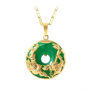 Natural jade donut pendant with dragon and phoenix embossed in gold metal, front view showing intricate design