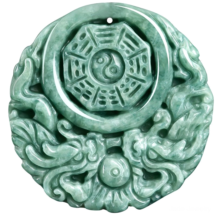 Ultra close-up macro photography of jade pendant carving showing dragon and yin yang symbols