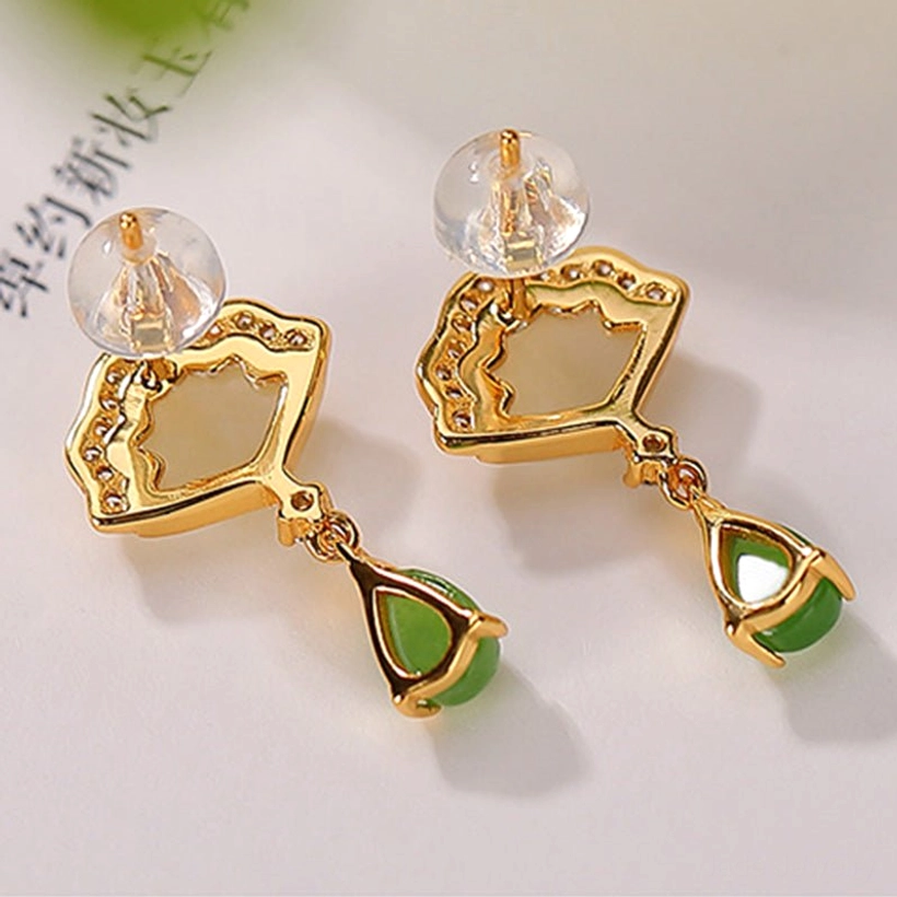 Back view of gold-plated jade earrings showing earring post and plastic backs