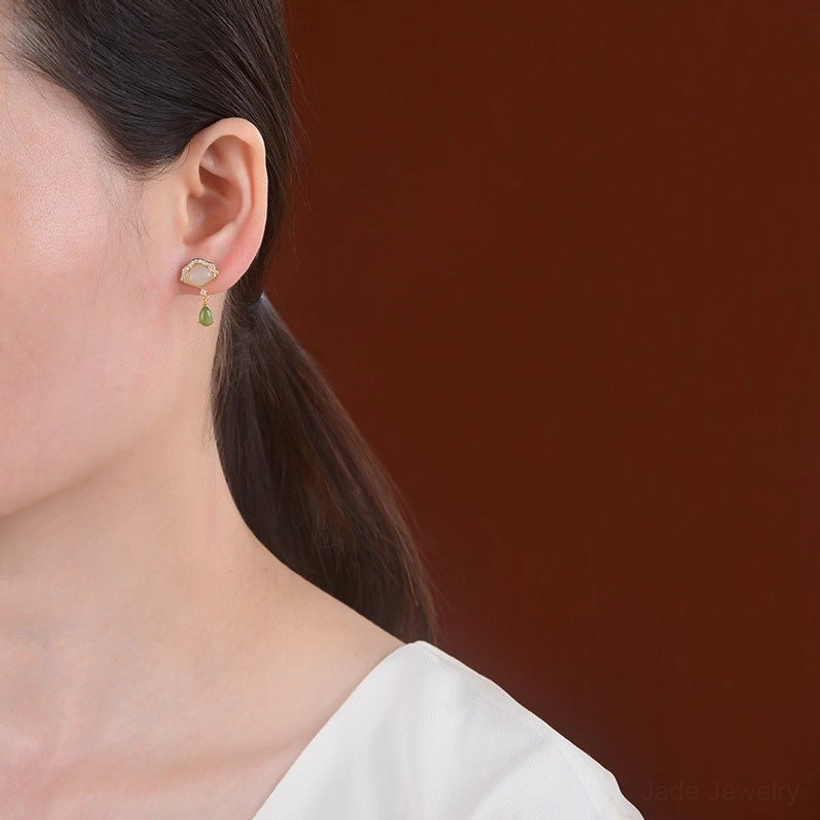Jade fan drop earrings showing delicate gold chain connection between stones