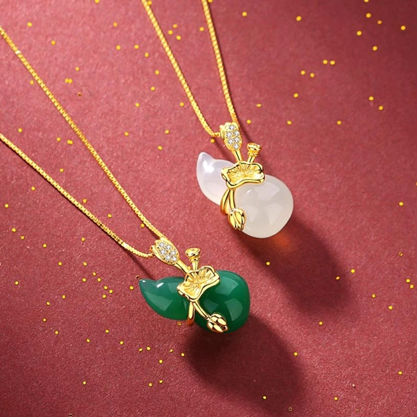 Comparison of green cyan jade and white jade gourd pendants with matching gold decorative hardware and adjustable chains