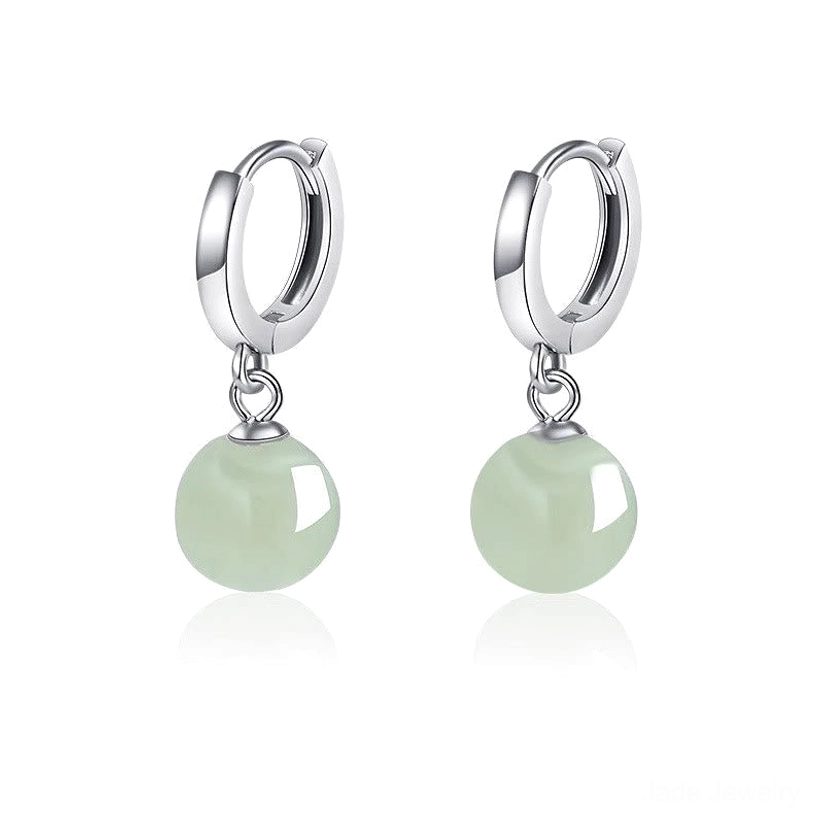 Polished 925 sterling silver jade bead drop hoop earrings pair, studio flat lay on reflective white background