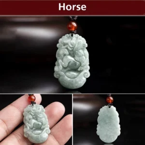 Close-up detail of hand-carved natural jade horse pendant with intricate carving and red bead accent on dark background