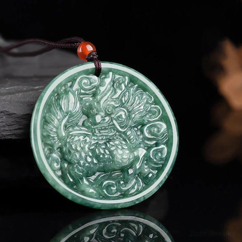 Side front view of green jade kirin pendant showing smooth texture and complete carved design