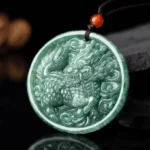 Natural jade kirin pendant necklace with intricate carved design and mottled green jade, front overhead view