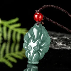 Hand-carved nine-tailed fox jade pendant shown in three-quarter side angle with rope necklace