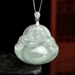 Natural jade laughing Buddha pendant necklace with light green translucent jade and silver-toned hardware, front flat view