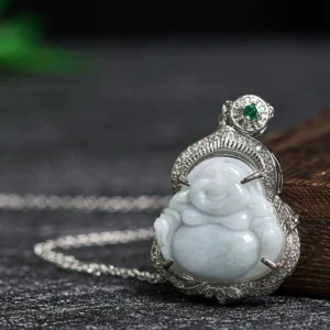 Side oblique view of Laughing Buddha jade necklace showing ornate silver filigree frame and green gemstone bail accent