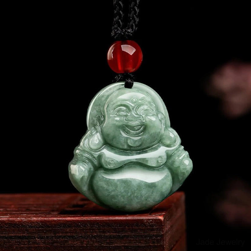 Three-quarter angle view of natural green jade Laughing Buddha pendant highlighting full rounded body carving and three-dimensional sculpture depth