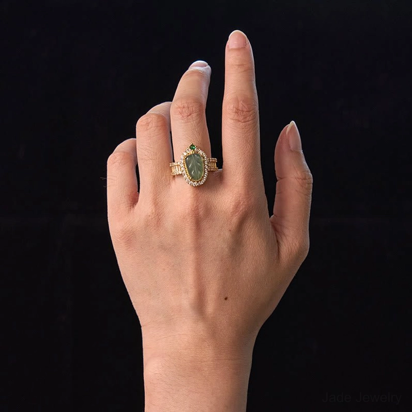 Woman wearing natural jade leaf diamond ring on middle finger demonstrating perfect fit and wearable elegance of the adjustable design