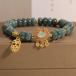 Natural jade lock charm bracelet with gold-toned fortune pendant in premium gift box
