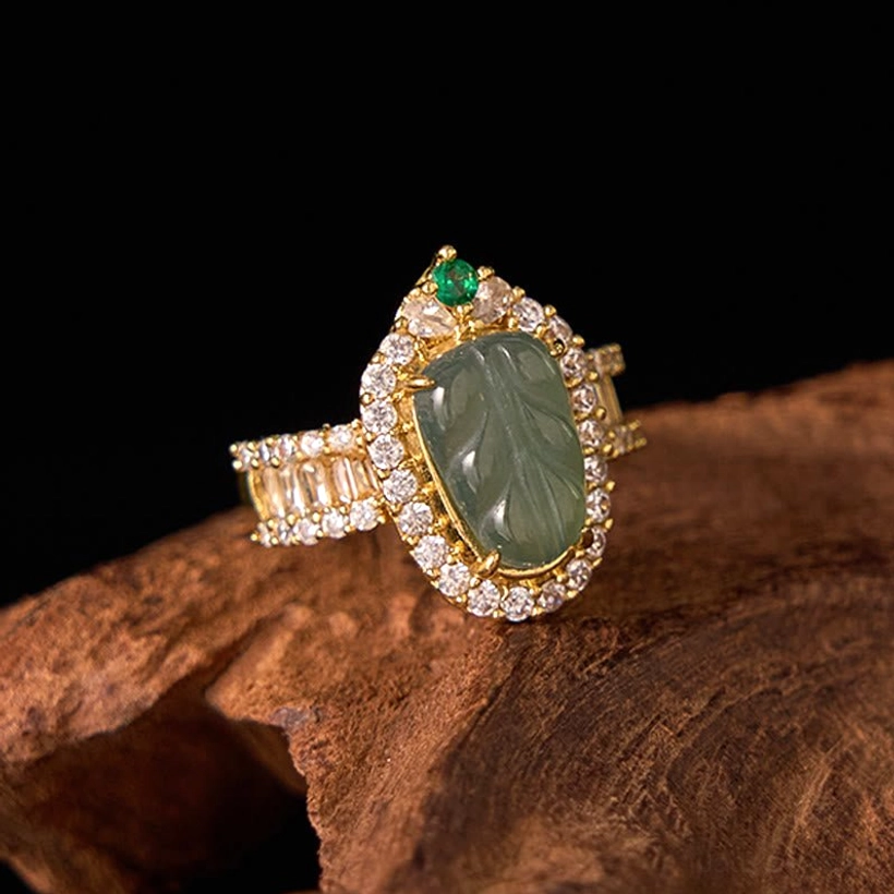 Natural jade leaf luck ring right three-quarter view highlighting sparkling cubic zirconia accents framing the green jade stone