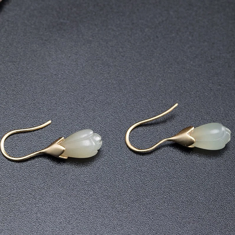 pair of magnolia jade drop earrings side view flat lay dark background sterling silver