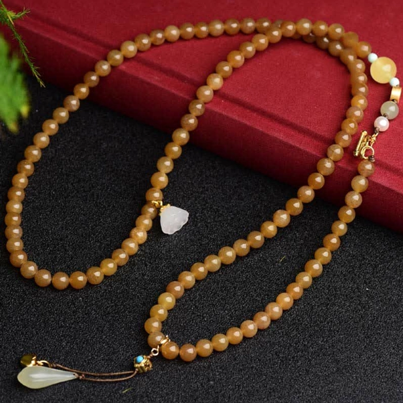 Long beaded jade mala necklace with brown jade beads and drop jade pendant with gold fittings