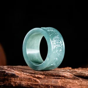 Jade prosperity ring side profile view displaying engraved om mani padme hum mantra and smooth polished band