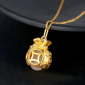 Gold-plated money bag jade pendant necklace side profile displaying carved coin motif, delicate chain, and compact pendant dimensions perfect for layering or solo wear