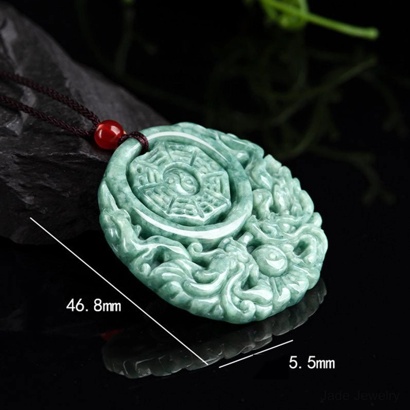 Jade dragon yin yang necklace with dimension labels 46.8mm x 5.5mm from side angle
