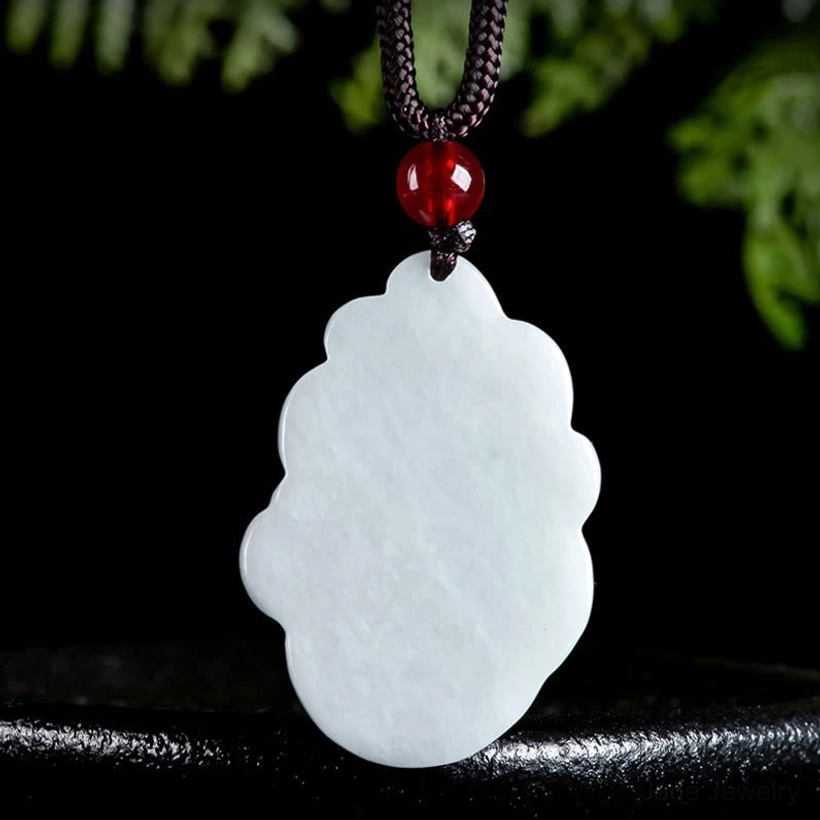 Smooth back view of natural jade nine-tailed fox pendant showing polished surface