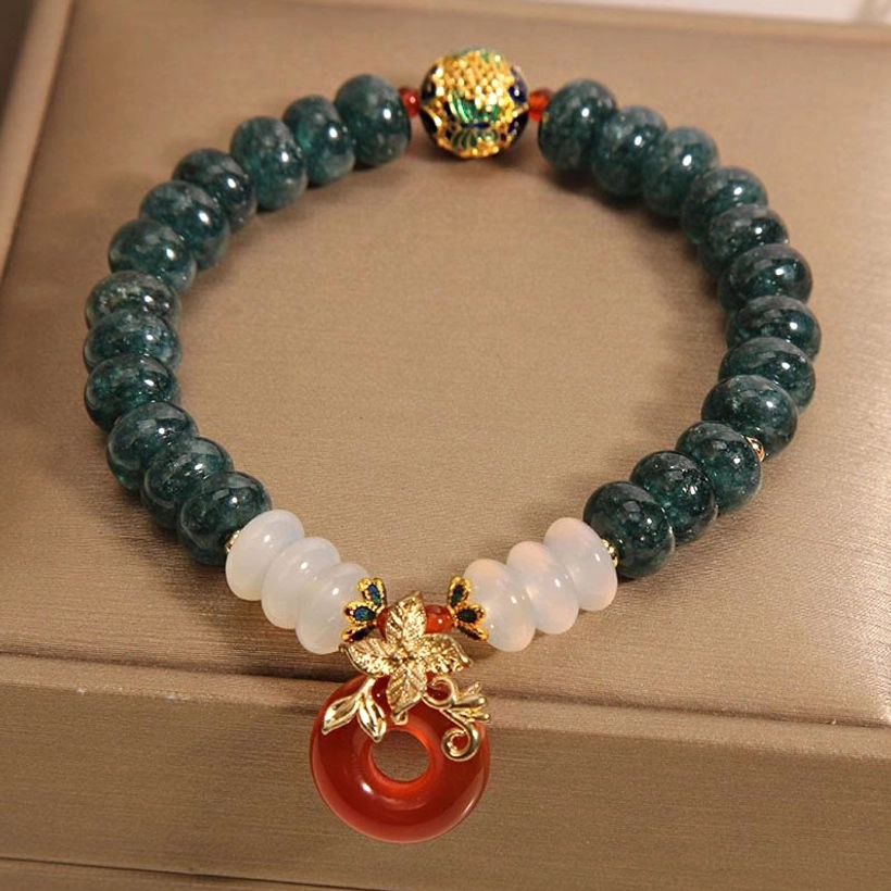 Complete jade white agate red agate bracelet with gold hardware set - side view on display tray