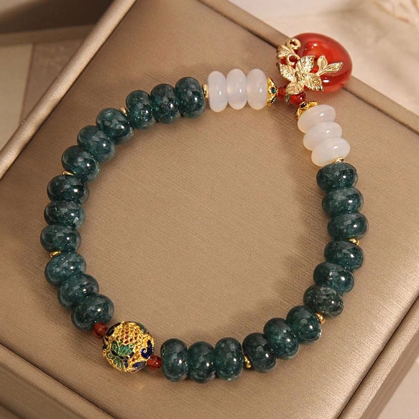 Dark green jade white agate red agate peace buckle pendant bracelet overhead flat lay