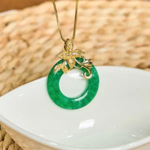 Handcrafted cyan jade circle pendant with delicate gold floral decoration and chain