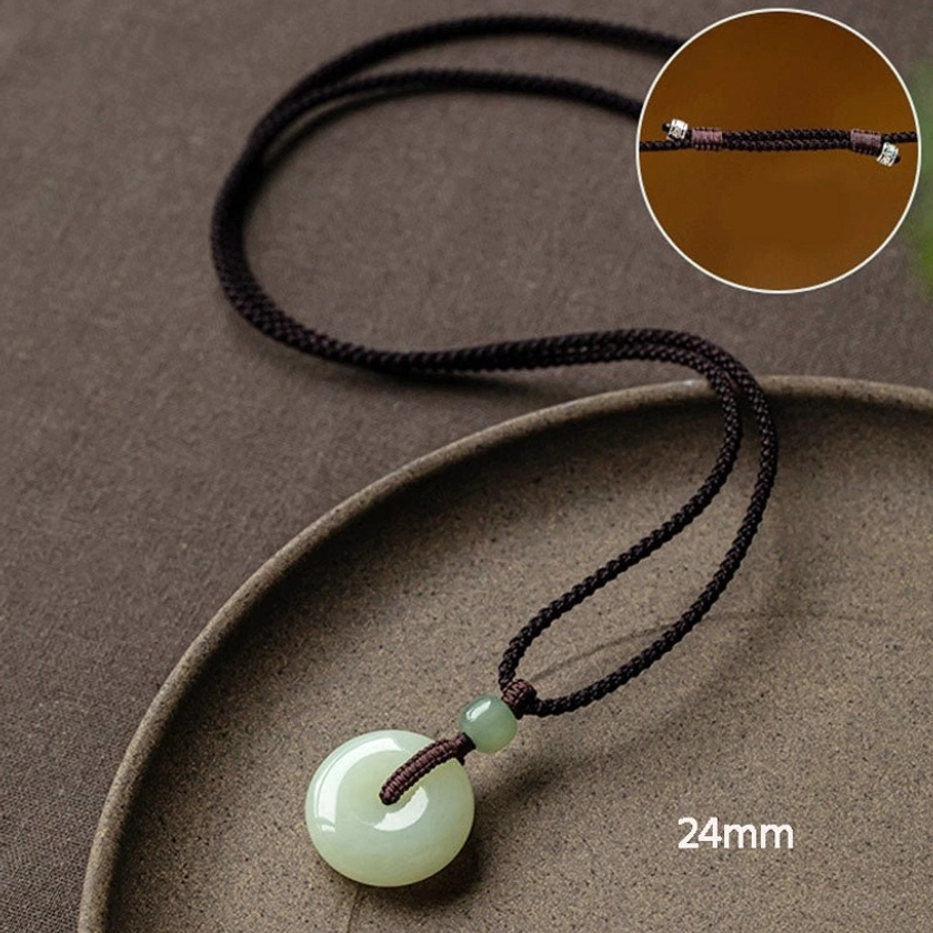 Jade peace buckle prosperity symbol unbroken ring harmony protection necklace ancient Chinese tradition