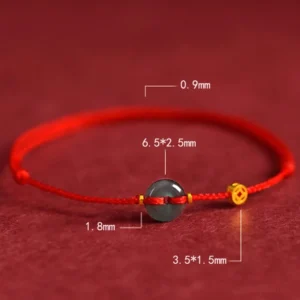 Jade peace buckle bracelet close-up dimensional view showing red string, jade donut charm, and gold-plated copper bead spacing
