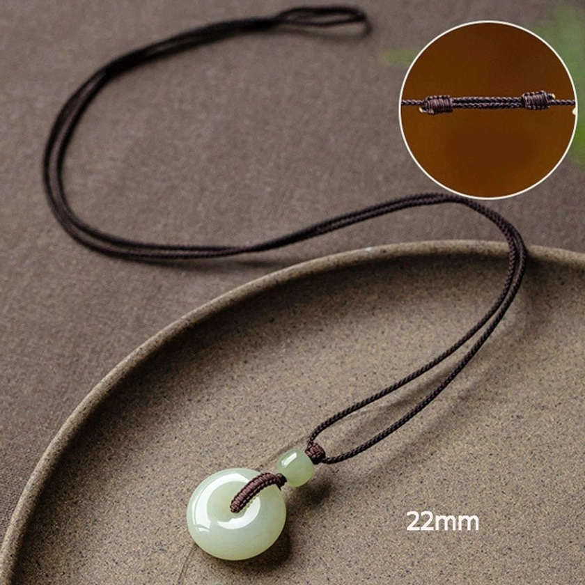 Jade peace buckle necklace with traditional woven cord brown braided natural fiber eco-conscious