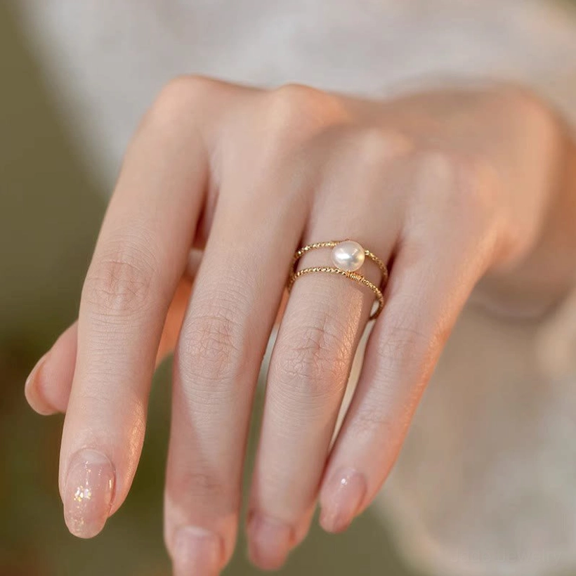 Jade pearl adjustable ring detail shot showing twisted copper bands craftsmanship and round stone setting