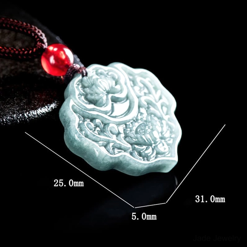 Celadon jade pendant with size dimensions labeled 25.0×31.0×5.0mm on leather background