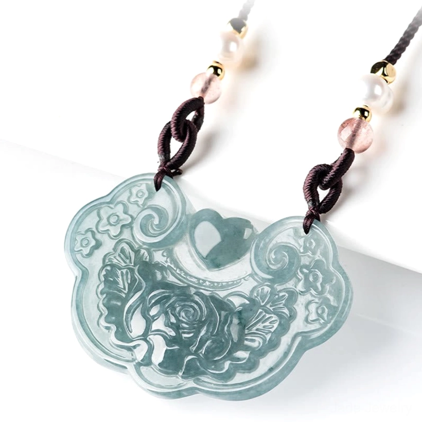 Side profile view of natural jade peony lock pendant showing smooth bluish green carving, flat floral design clarity