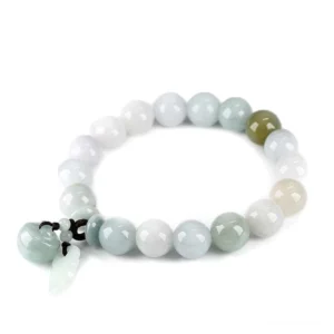 Natural jade pixiu bracelet overhead flat lay view with mixed light green and lavender beads on white background