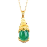 Natural jade Pixiu pendant necklace featuring gold-plated setting with matte finish, authentic green jade stone, and traditional Pixiu charm design - front view on white background