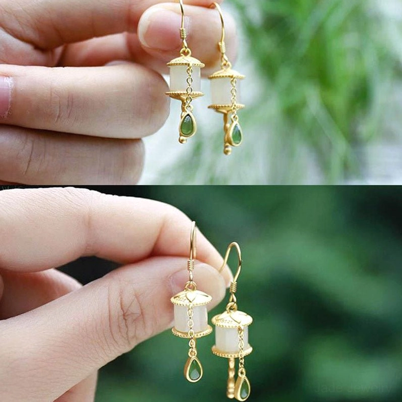 Close-up detail of jade prayer wheel earrings highlighting handmade 925 sterling silver craftsmanship, white jade beads, and traditional prayer wheel design