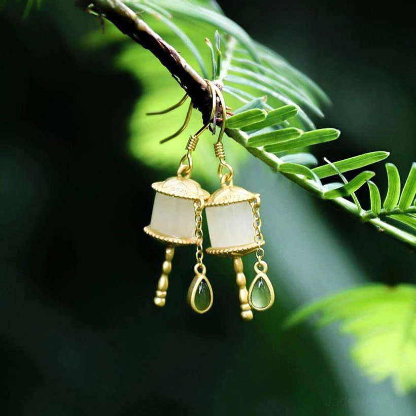 925 sterling silver jade prayer wheel drop earrings with authentic natural jade stones showing unique color variations and traditional Buddhist inspiration