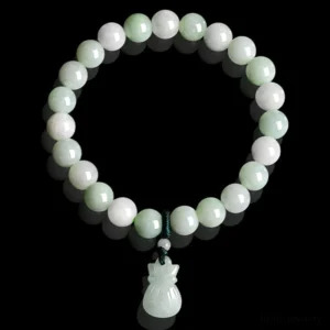 Top-down flat lay view of circular jade beaded bracelet with carved money bag pendant on black background, highlighting light green jade stones