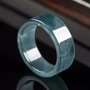 Natural blue jade prosperity ring handcrafted band, three-quarter side view showing polished finish and natural jade veins