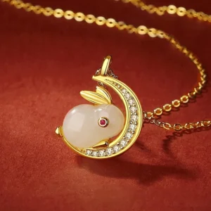 925 sterling silver curb chain with handcrafted white jade rabbit moon pendant showing side profile and red corundum eye detail - celestial protection necklace