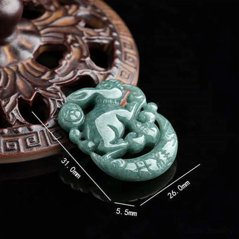 Jade rabbit crescent moon pendant dimensions 31mm x 26mm x 5.5mm on wooden display stand, side profile close-up showing polished carved details