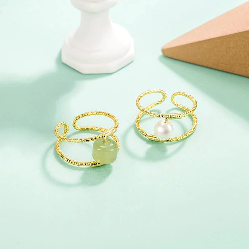 Jade adjustable ring lifestyle shot showing versatile styling with other jewelry pieces for everyday wear