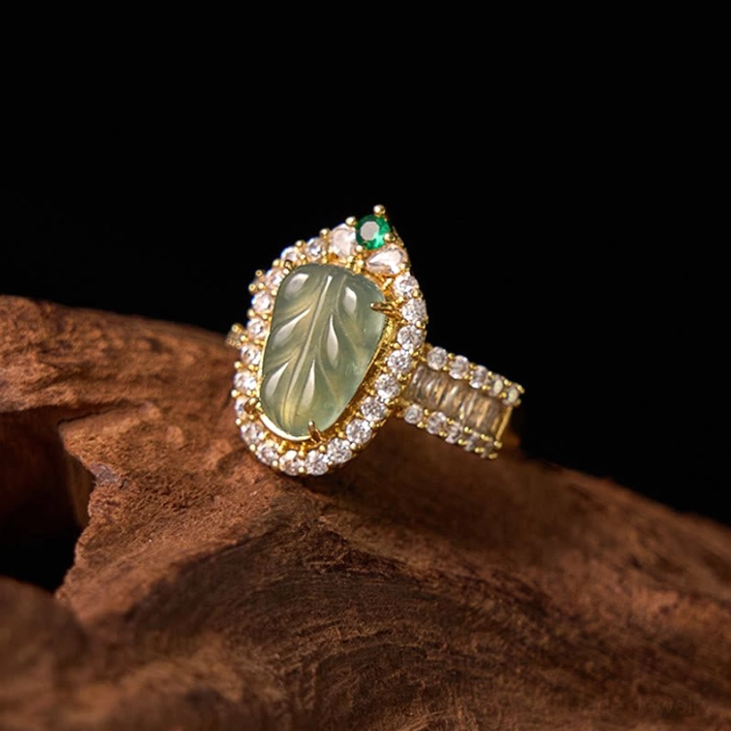 Natural jade leaf ring right side view displaying the intricate baguette diamond setting along the gold-plated copper band