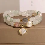 Double-layer jade shell pendant bracelet with white round beads and gold hardware in brown gift box